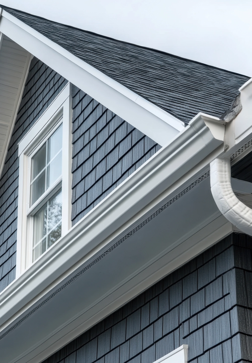 architectural-detail-of-a-modern-home-featuring-gray-shingle-siding-in-southern-maryland