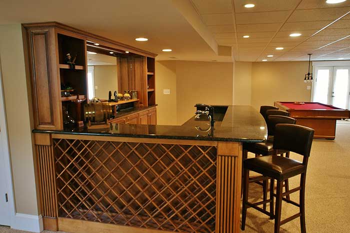 basement-finishing-with-bar-theme-and-entertainment-pool-game-with-white-trim-door-on-the-background-in-huntingtown-maryland