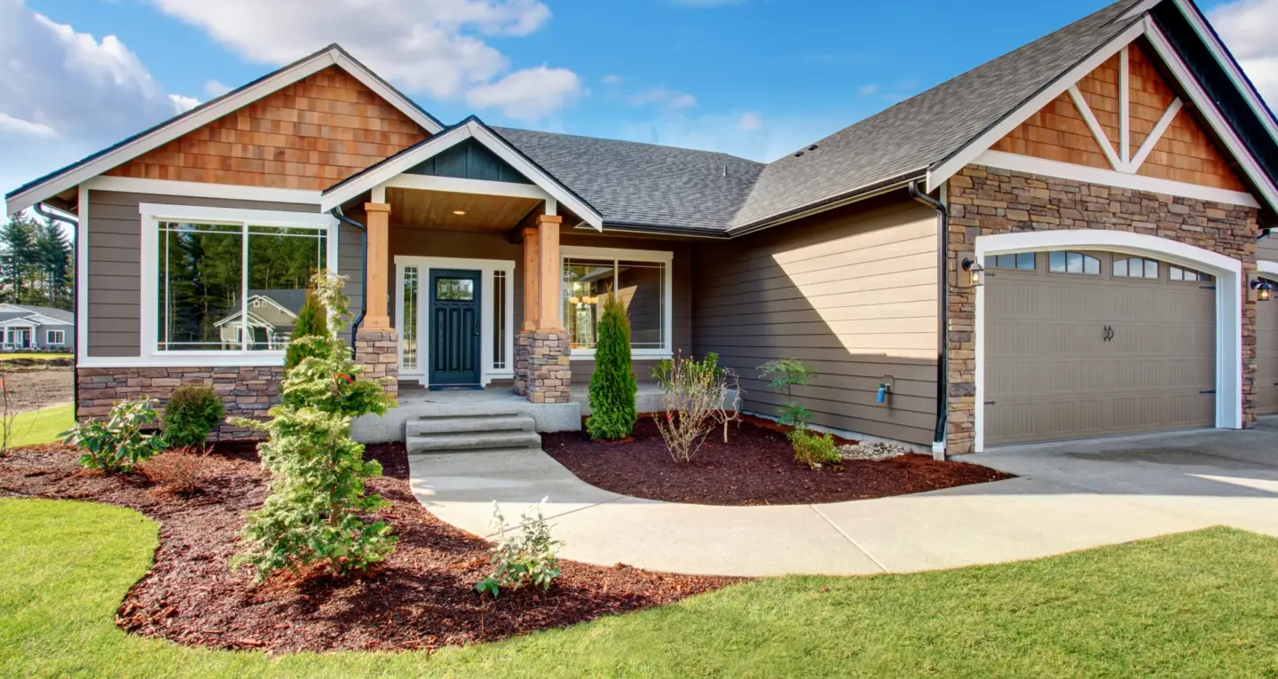 garage-door-addition-on-the-customize-house-with-decorative-plants-on-the-lawn-in-huntingtown-maryland