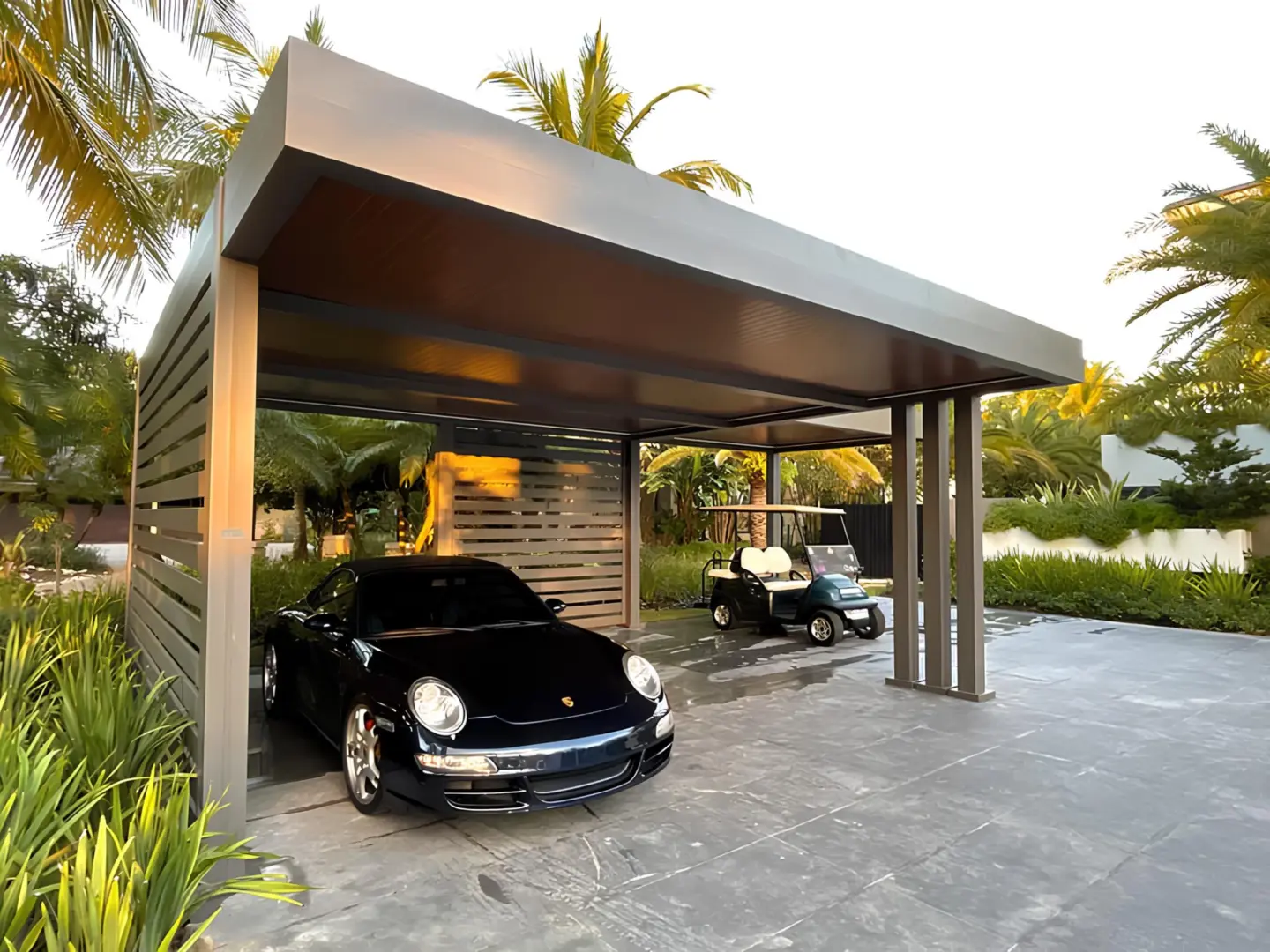 gray-bronze-r-car-led-strip-wood-grain-carport-surrounded-by-grass-and-trees-on-the-background-in-southern-maryland