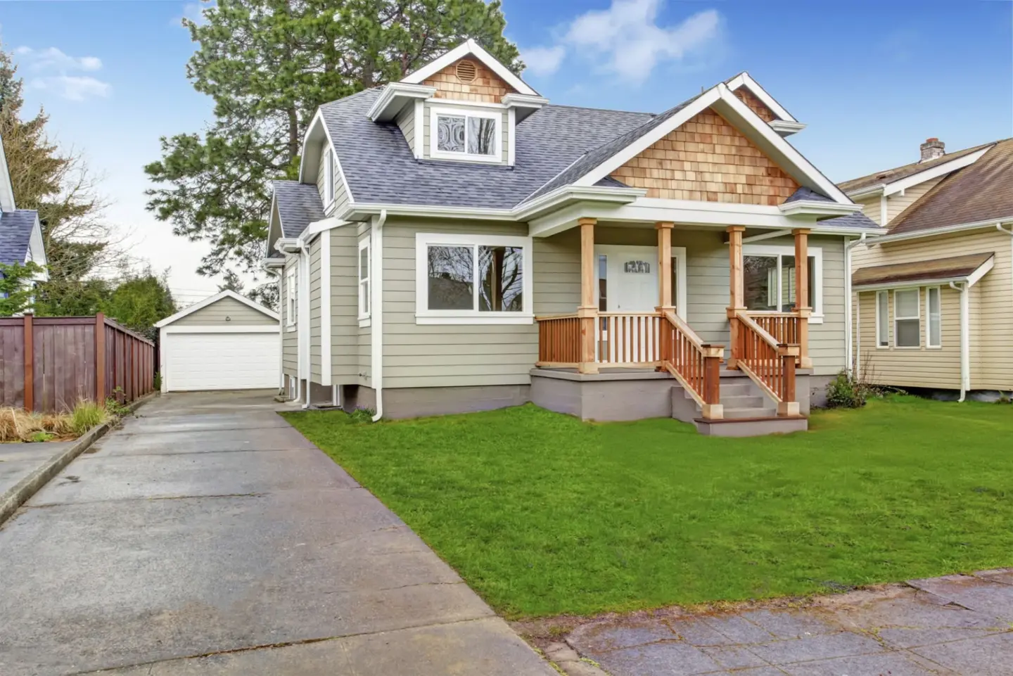 house-exterior-with-entrance-porch-and-garage-view-on-the-residential-house-with-clean-lawn-and-shed-on-the-backyard-in-southern-maryland