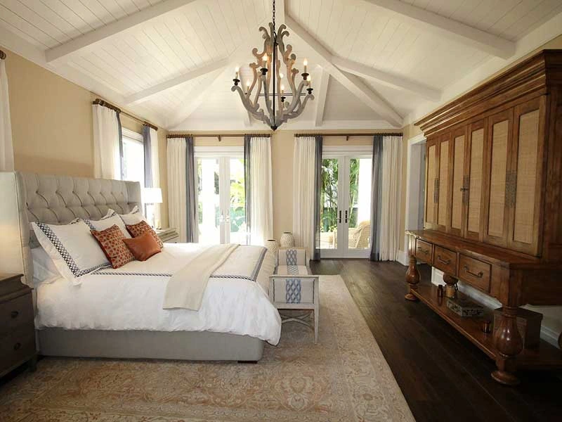 master-suite-bedroom-addition-with-two-white-trim-doors-and-hanging-lights-on-the-white-ceiling-in-huntingtown-maryland