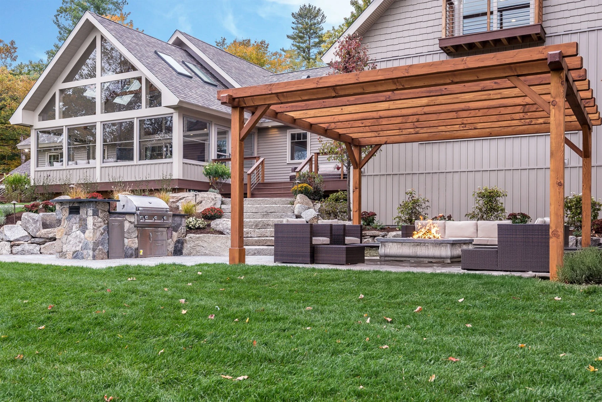 pergola-on-the-outdoor-living-space-with-fire-place-and-screened-in-porch-on-the-commercial-house-with-cable-railing-in-southern-maryland
