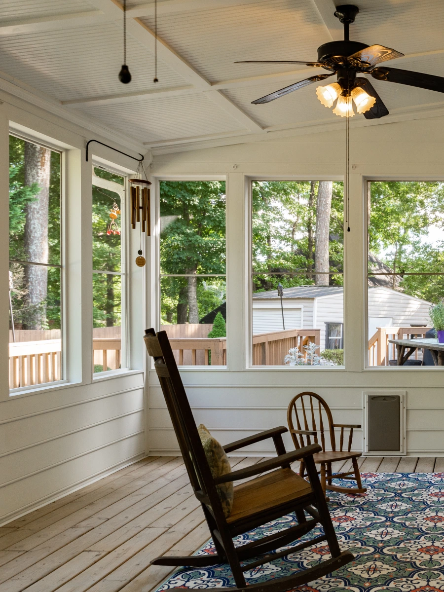 porch-enclosure-with-small-and-big-rocking-chair-and-a-fan-with-lights-on-the-ceiling-on-the-residential-house-in-southern-maryland