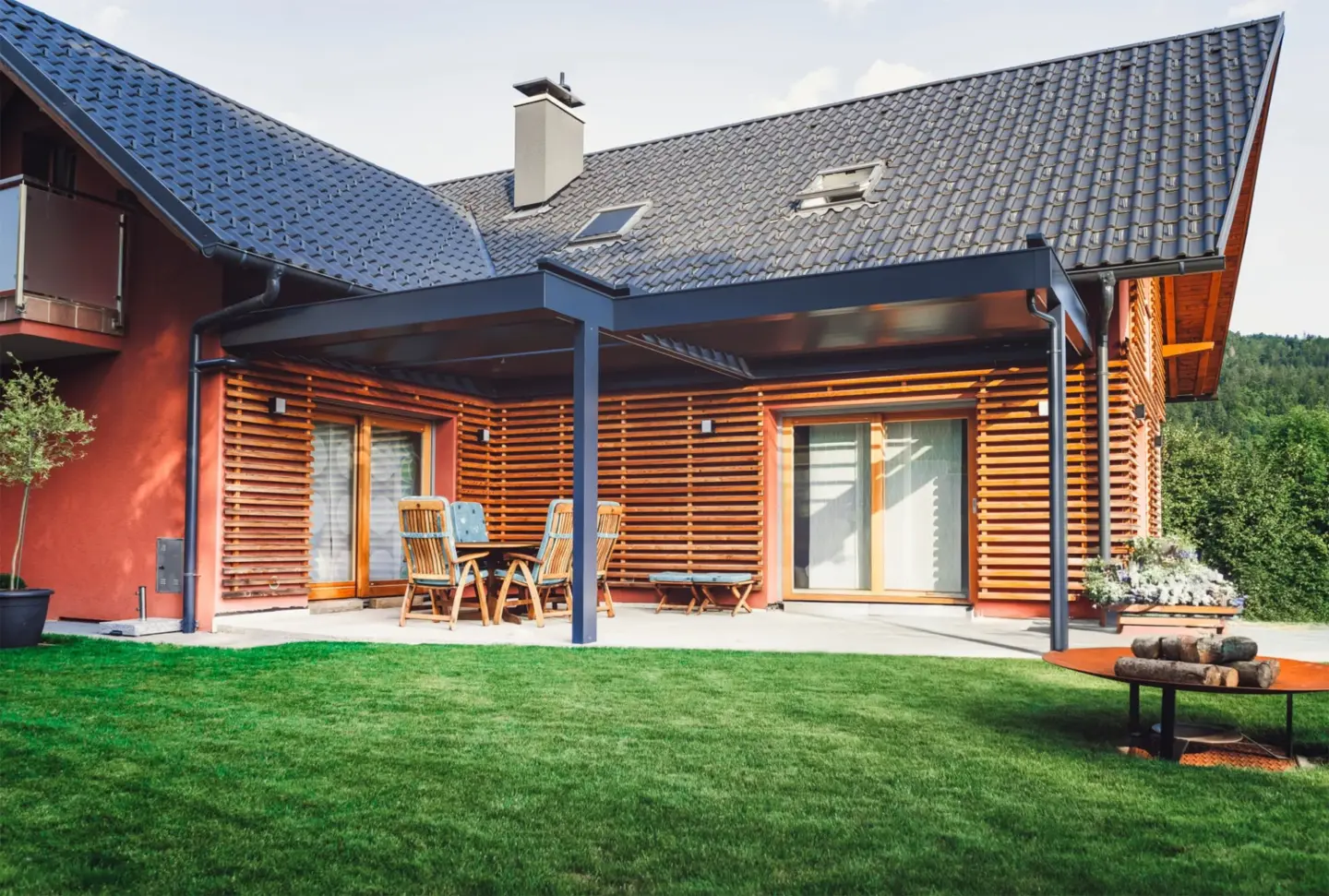 porch-installation-on-the-modern-house-with-black-metal-pergola-and-outdoor-living-spaces-with-fire-place-in-southern-maryland