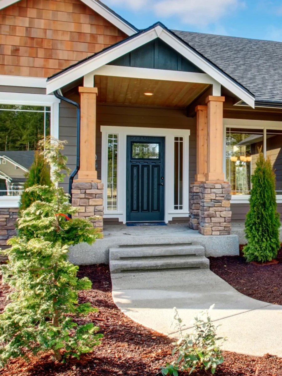 residential-home-with-door-installation-and-portico-with-decorative-grass-design-on-the-walkway-in-huntingtown-maryland