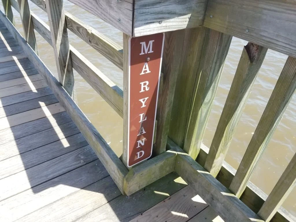 wood-deck-with-railings-and-maryland-logo-on-the-railing-in-southern-maryland